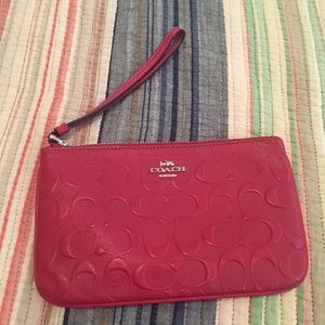 COACH Large embossed leather wristlet Red